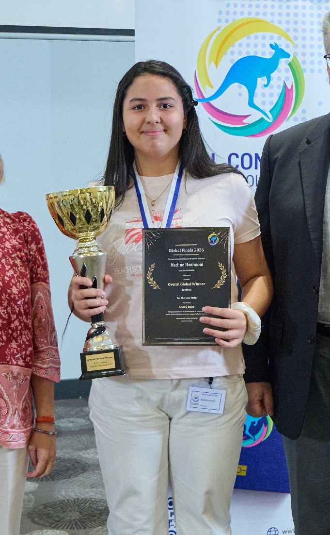 Nadine Hasnaoui of Morocco holding her Overall Global Winner award